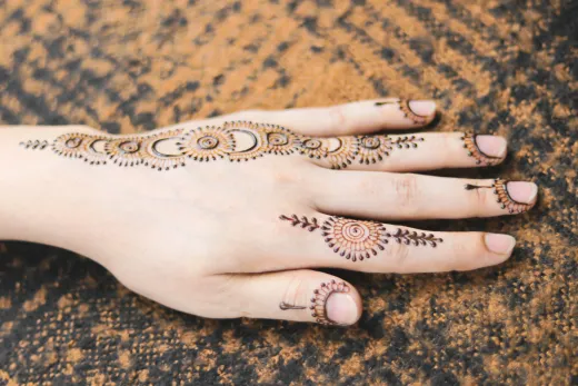 Close up of an intricate mehndi design on a ha - arabic mehndi
