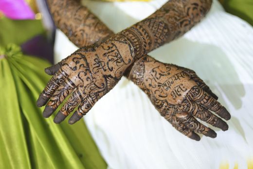 Indian bride showing her hand s mehndi tattoos design - bridal mehndi design