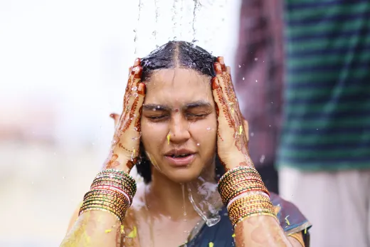 A woman participates in a traditional indian w - henna hair