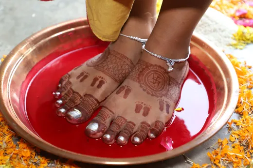 Intricate henna designs on feet during a vibra - henna hair colour