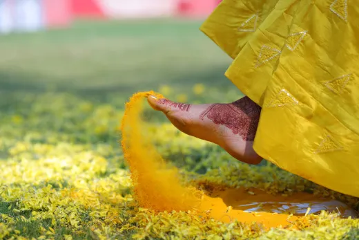 Close up of a foot adorned with henna during a - henna paste