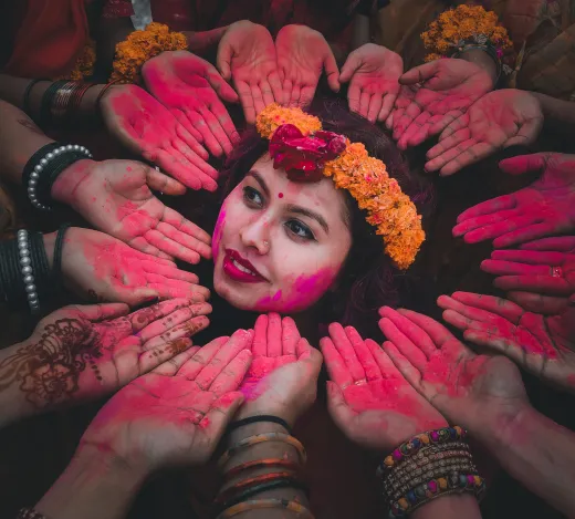 Colorful holi celebration with a joyful woman - henna paste