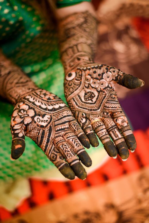 Womans hand with henna it - simple Arabic mehndi design